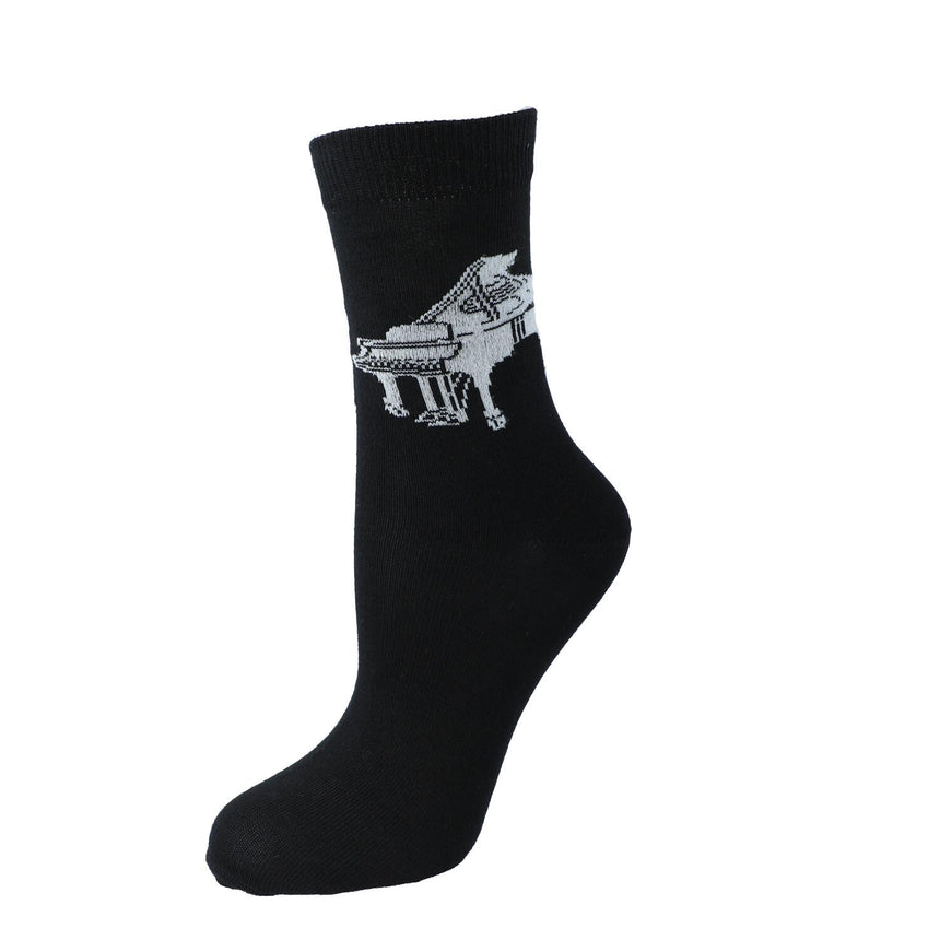 Chaussette Kübler noire tendue, motif piano à queue, sur fond blanc