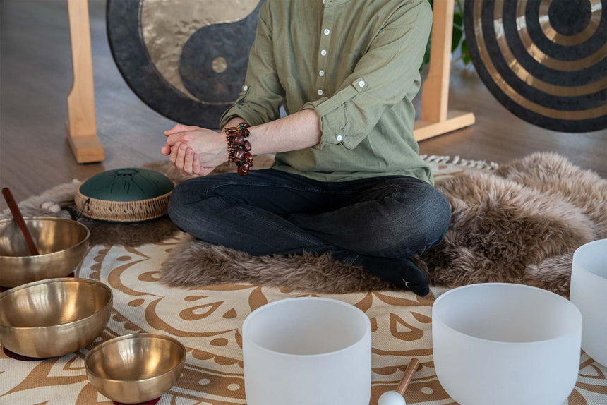 MEINL Sonic Energy Pala bracelet SPB with brown seed shells, worn in front of singing bowls and gongs