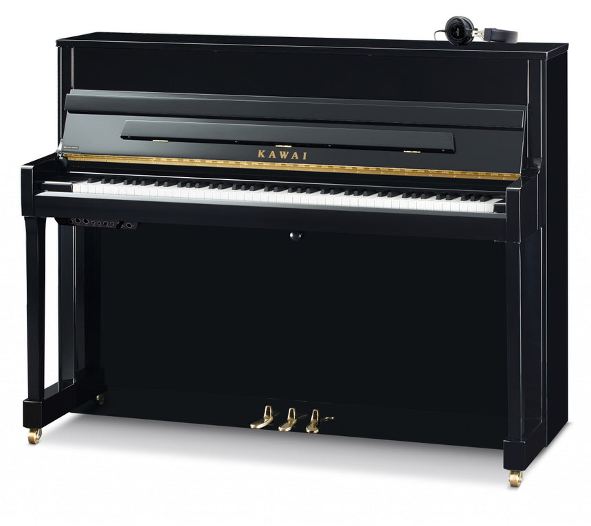 Kawai K-200 ATX4 upright piano in polished ebony – three-quarter view with ATX4 system and headphones.