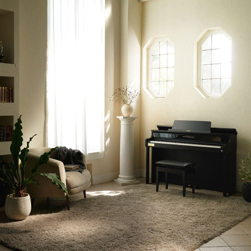 Casio AP-750BK digital piano in black – full view in a bright living room.